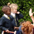 School kids listen to teacher