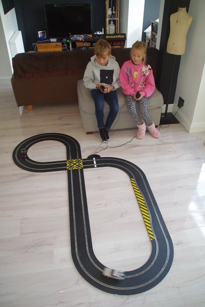 Boy and girl with Scalextric set from Hornby Hobbies
