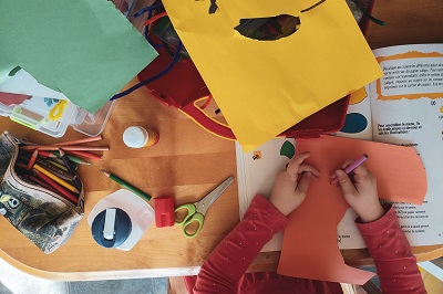 child doing craft project, photo by Sigmund