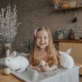 Photo by Marina Abrosimova | Girl with rabbits and Easter eggs