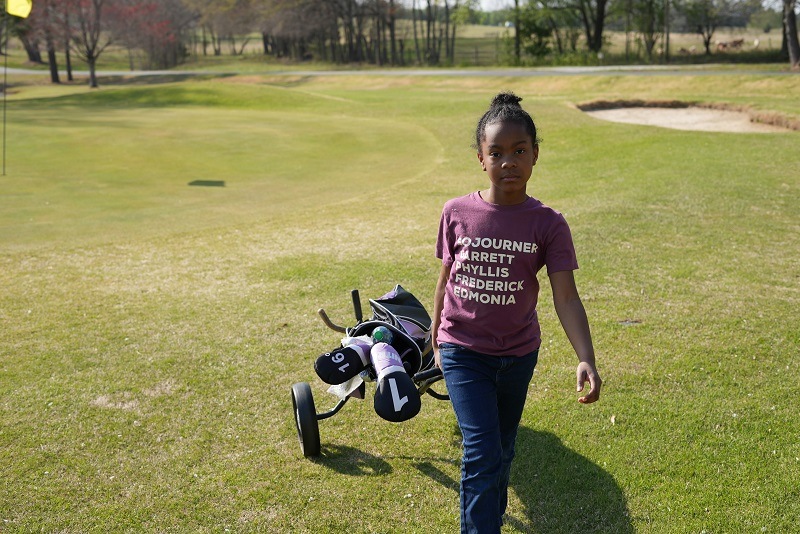 Girl on a golf cource by anthony-mckissic-unsplash
