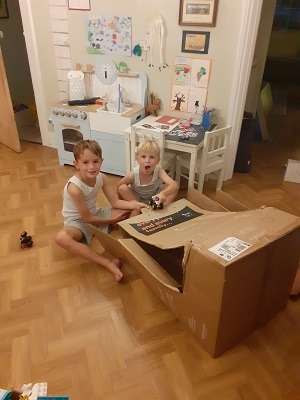 Apramo car seat. Boys are playing with the box