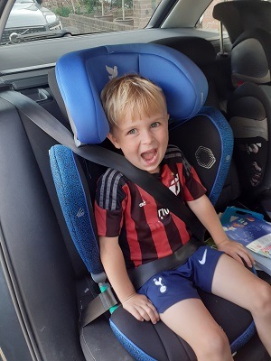 Boy in Apramo Booster seat