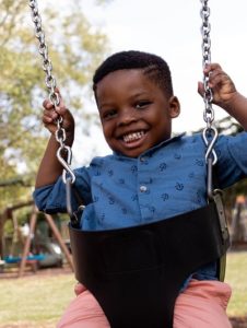 Boy on swings by_zoe graham -unsplash