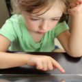 Little girl with a tablet Photo: Hal Gatewood. Unsplash