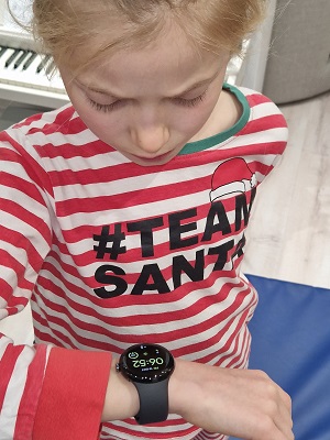 Girl checking reading on smart watch