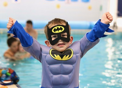 Boy in a batman costume | Water Babies Splashathon