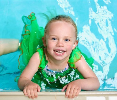 Girl in Tiana costume in the swimming pool | Water Babies Splashathon