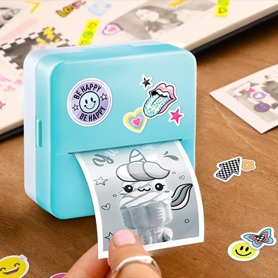 Photo Creator Instant Pocket Printer with a sticker just printed