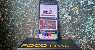 Mobile phone with M&D website on the screen