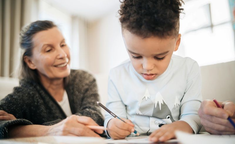 Grandparents with the child studying