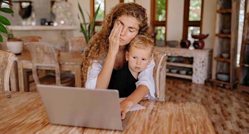 Mother and toddler with computer