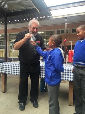 Philip Rose with children at SciTech session