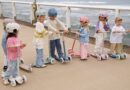 Group of children with Banwood scooters and helmets