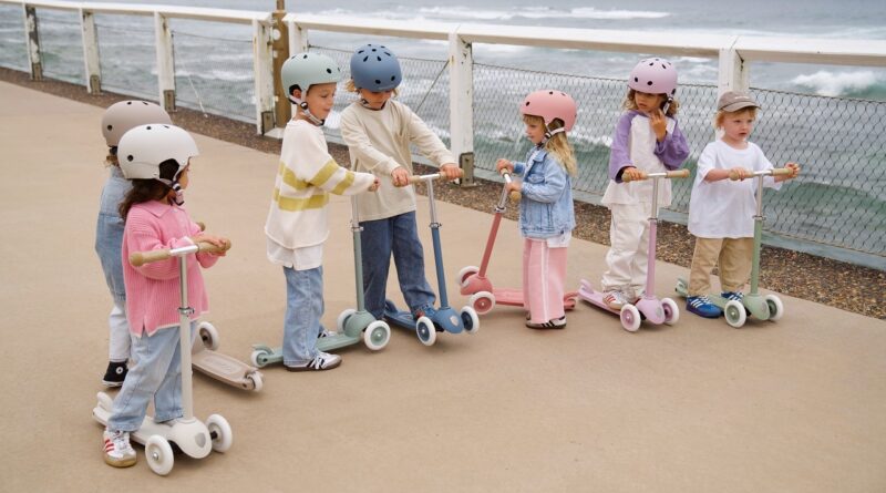 Group of children with Banwood scooters and helmets