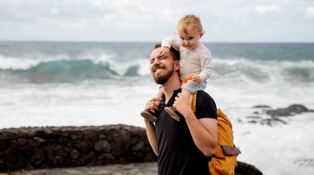 Father and toddler on the beech