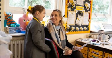 Greenbank Prep pupil and a teacher talking in the classroom