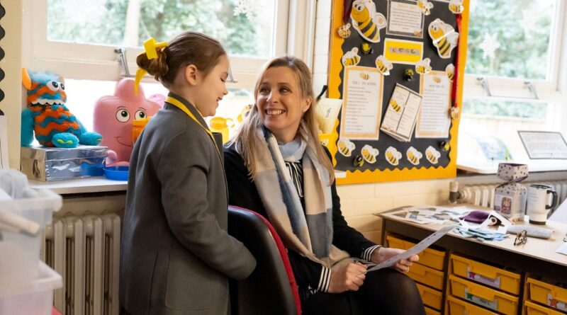 Greenbank Prep pupil and a teacher talking in the classroom