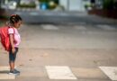 Little girl with a backpack at zebra crossing on the way to school | Photo by Aniekan Umoren at pexels