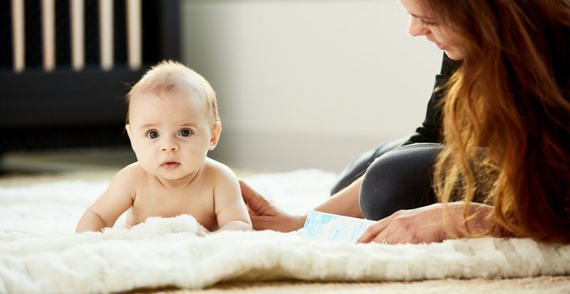 Baby and mum on the rug. Unsplash