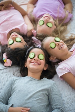Skincare. Girls with cucumbers on their eyes.