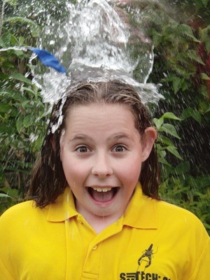 Girl under water splash | SciTech holiday camp
