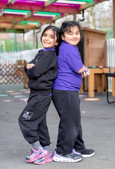 Two girls at the MHSG's outdoor playing area