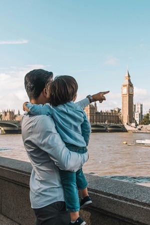 Father and son watching Big Ben. London