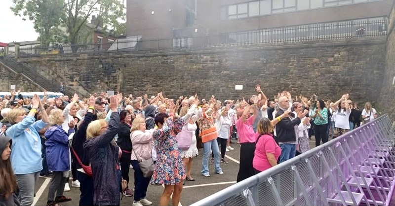 Vintage Vibes spectators enjoying the show on the stage