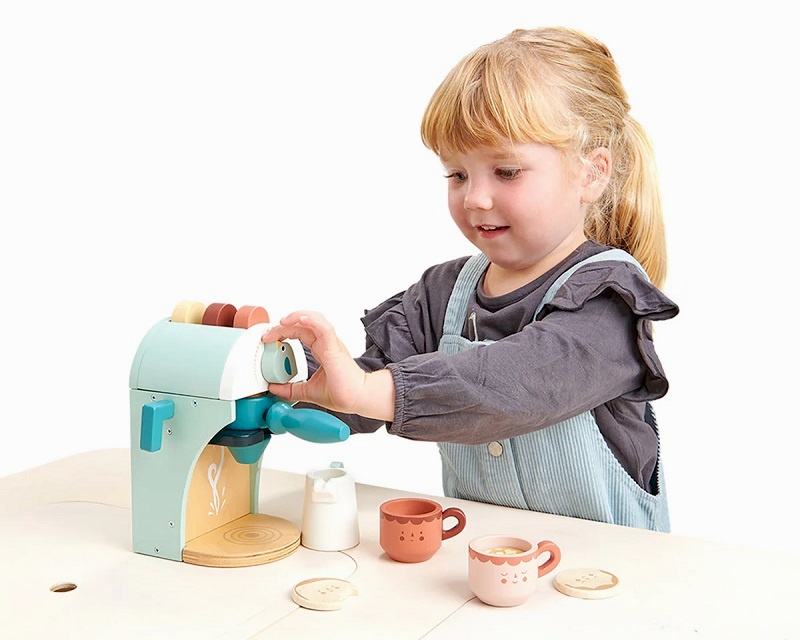 Girl playing with babyccino coffee maker from Tender Teaf Toys