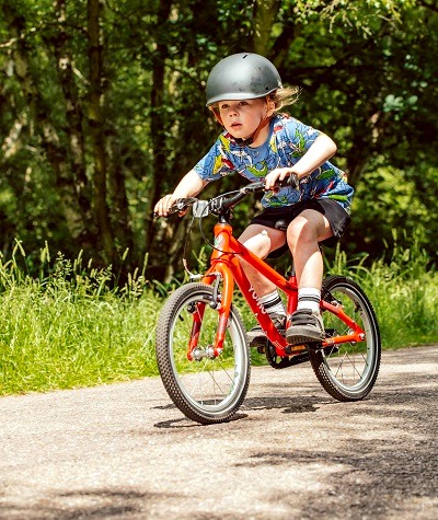 Adam LV Photography | Boy riding red YOMO Bike