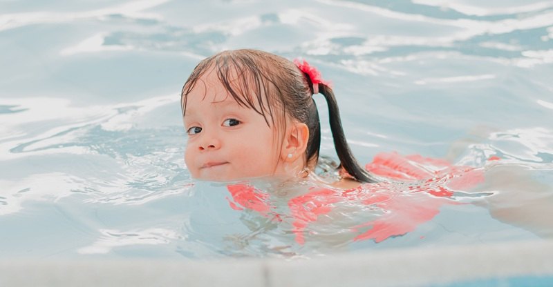 Swimming little girl