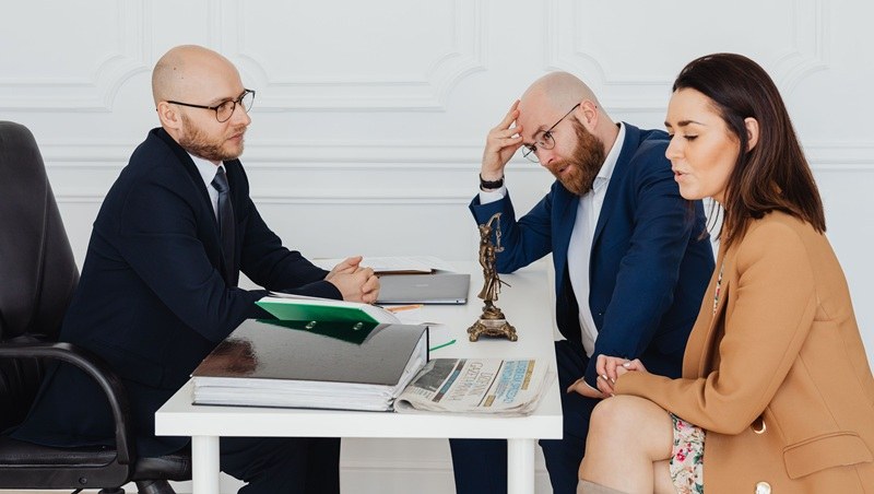 Man and Woman visiting solicitor