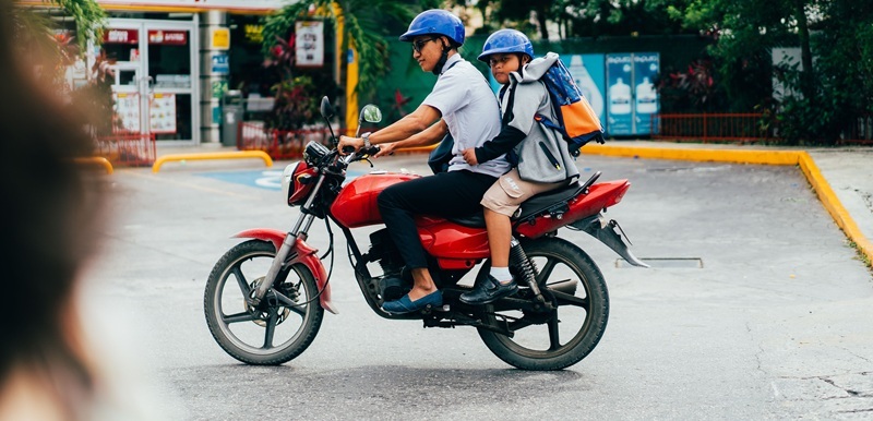 Adult and Child on a motorbike