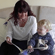 Parent and child enjoying reading book together