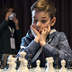 Ethan Gardiner thinking in the game against Vishy Anand