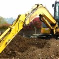 Girl on a digger at Diggerland in Kent