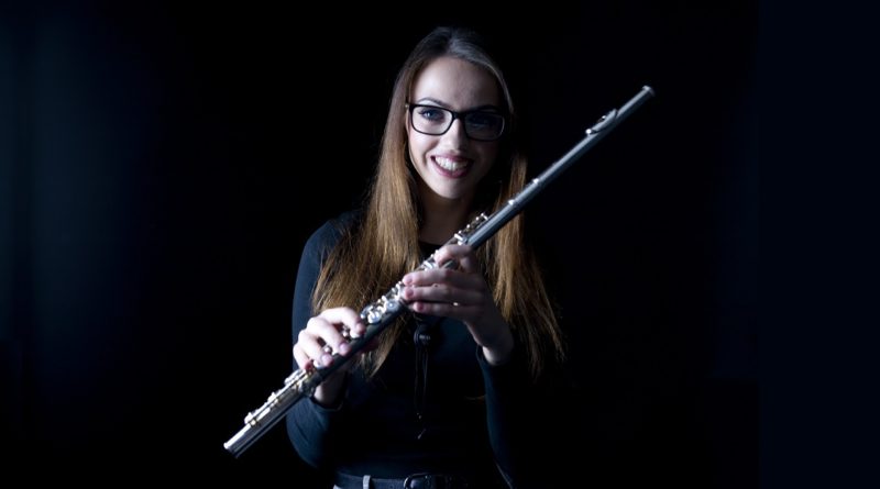 Kings Alumna Alex Clarke with her flute