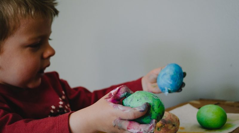 Boy playing with colour mold