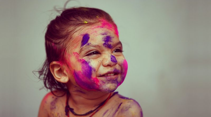 Little girl having fun at the Festival of Colours | photo: Pranav Kumar Jain, unsplash