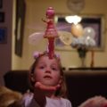 Girl is watching a flying fairy toy