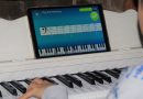 Boy learning to play piano