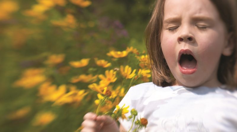 Hay fever - sneezing girl