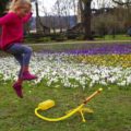 Girl launching Stomp Rocket stunt plane