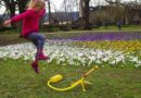 Girl launching Stomp Rocket stunt plane