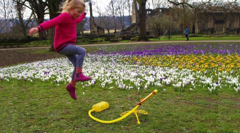 Girl launching Stomp Rocket stunt plane