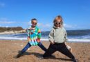 oy and girl on a beach