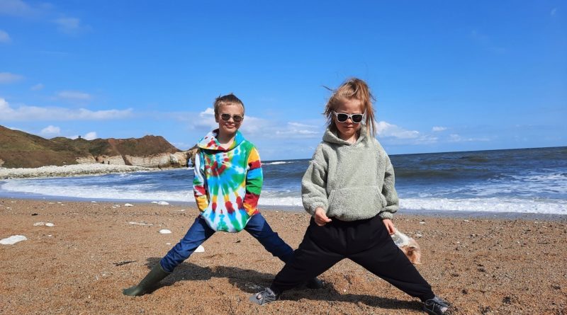 oy and girl on a beach