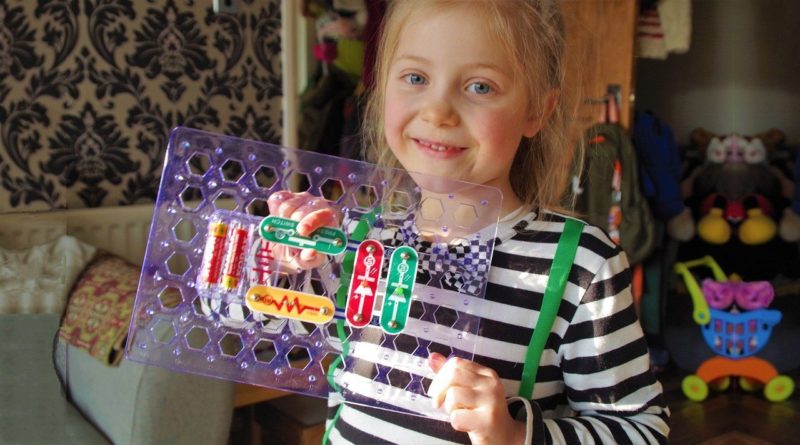 girl showing a base from John John Adams' Hot Wires kit