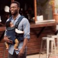 Father with a baby in a babybjorn mesh baby carrier